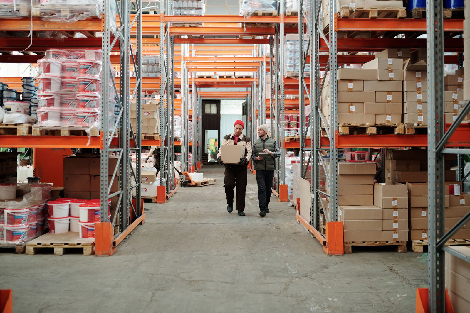 Procurement officer with delivery truck on site